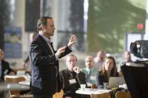 Man speaking in front of crowd